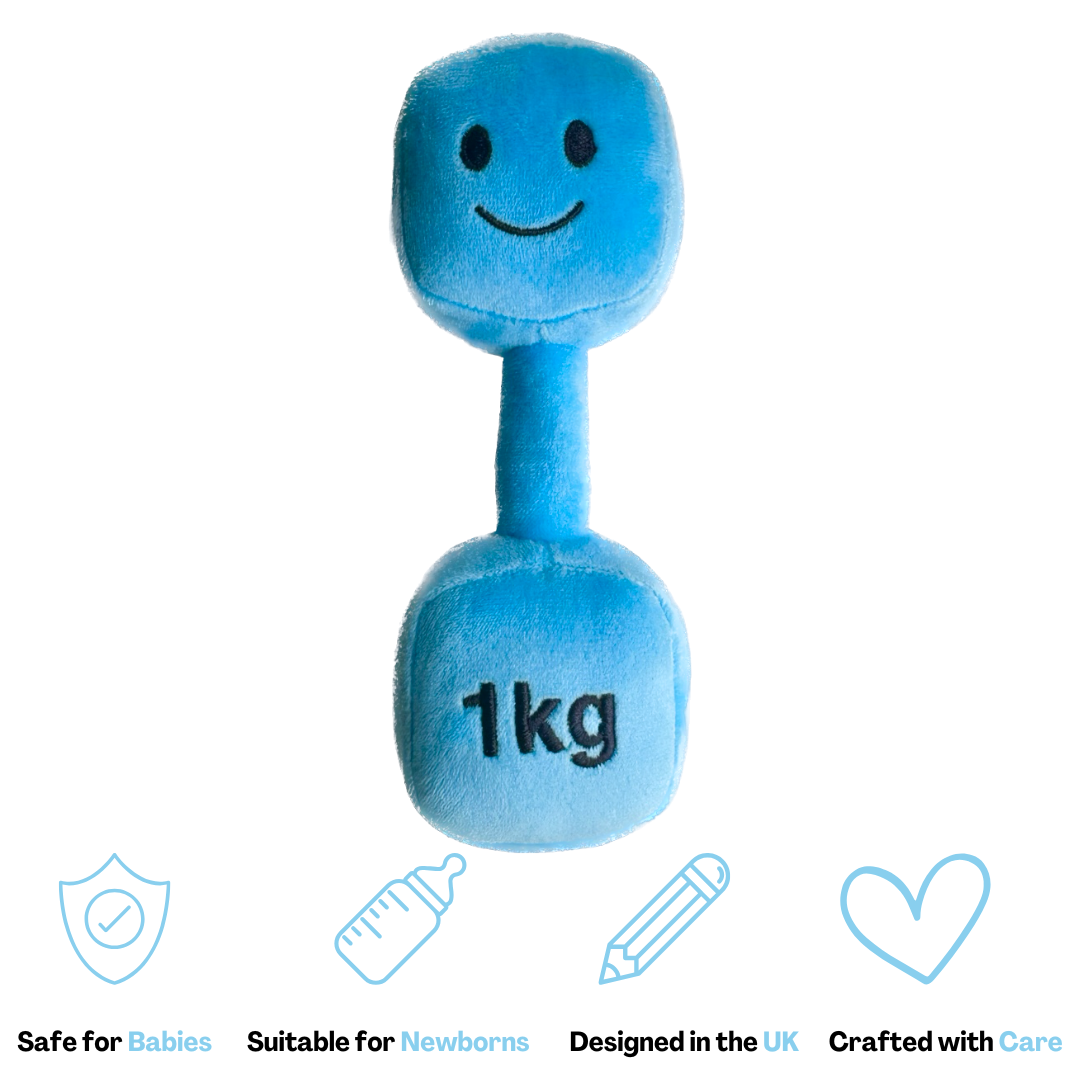 Bright blue plush dumbbell toy with a smiling face on one end and “1kg” embroidered on the other, photographed on a white background.