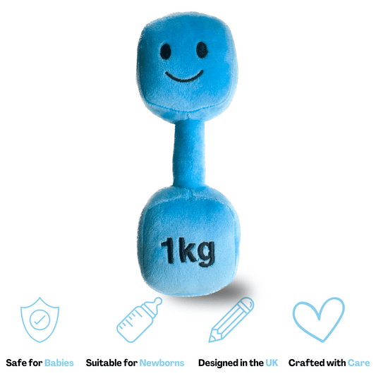 Blue plush dumbbell toy with embroidered smiley face and “1kg” text, shown with soft shadow. Baby-safe, suitable for newborns, designed in the UK, crafted with care.