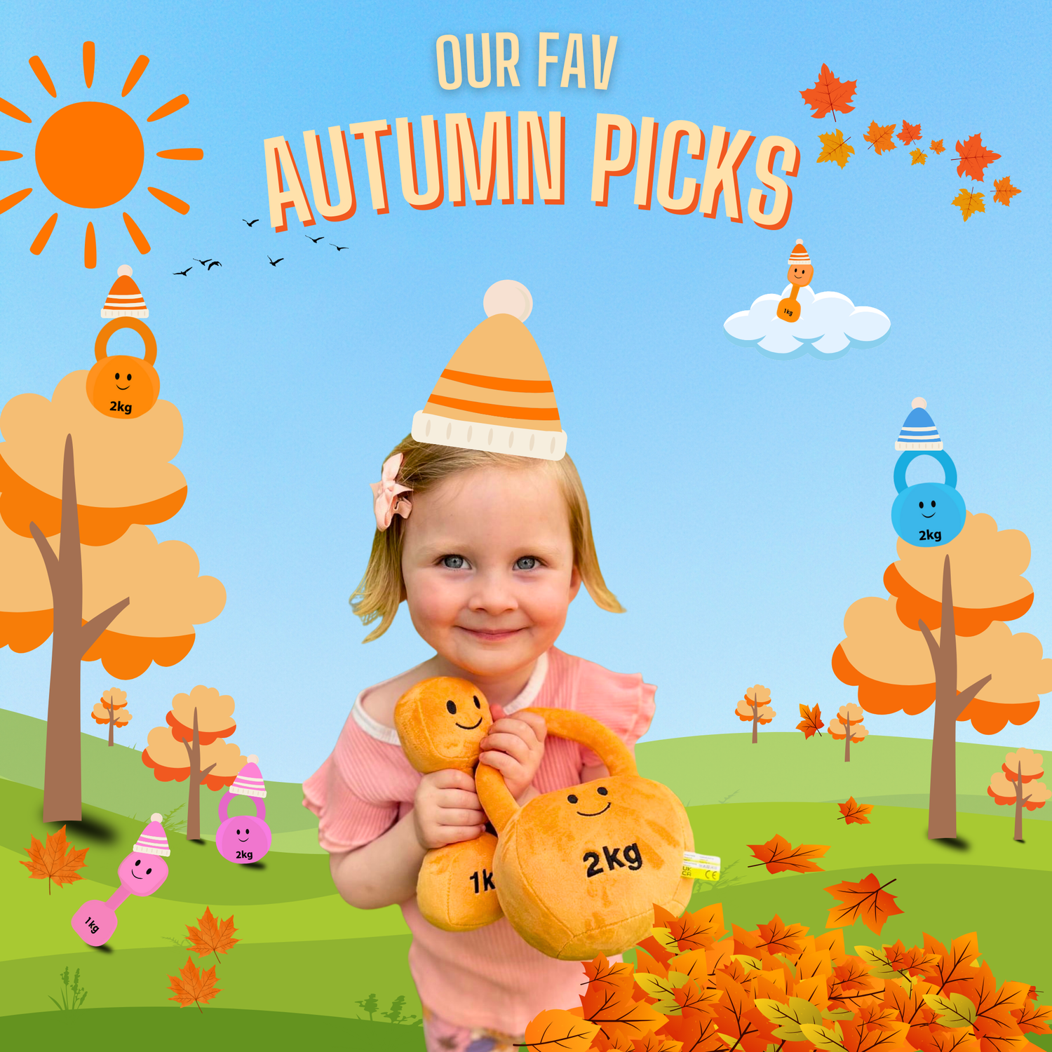 Smiling toddler holding orange plush dumbbell and kettlebell toys, wearing autumn hat in a cartoon fall scene with orange trees, leaves, and Hazza Toyz characters. Text reads “Our fav Autumn picks.”
